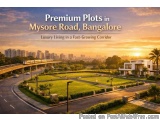 The image shows a beautiful view of Mysore Road in Bangalore, India. The sky is orange and yellow, indicating that it is eith...