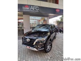 The image shows a black Toyota Land Cruiser SUV parked in front of a dealership named "Illumar AFC Authorised Fitment Centre"...