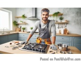 In this image, we can see a young man standing in a kitchen. He is wearing a grey t-shirt, apron, and a pair of goggles on hi...