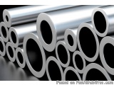The image shows a group of cylindrical pipes or tubes stacked on top of each other. The pipes are made of metal and have a sh...