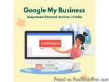 The image shows a woman sitting at a desk in front of a computer monitor with a banner that reads "Google My Business Suspens...