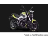 The image is a photograph of a yellow and black motorcycle. The motorcycle is parked on a black background, and the focus is...