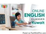 The image shows a young boy sitting at a desk in front of a computer. He is wearing a blue and white striped shirt and has a...