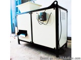 The image shows a large industrial machine with a white exterior and black metal frame. It appears to be a large, rectangular...