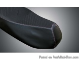 The image shows a close-up of a black leather seat cushion. The cushion is made of a soft, supple leather and has a textured...