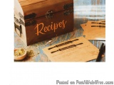 The image shows a wooden chest with the word "Recipes" written on it in a cursive font. The chest is open and appears to be a...