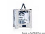 The image shows a 3D printer, specifically the Ultimaker 2.0 model. It is a white-colored machine with a sleek and modern des...