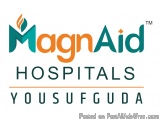 The image is a logo for a company called MagnaAid Hospitals. The logo is rectangular in shape and has a white background. The...