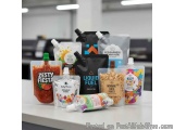 The image shows a collection of six different types of food packaging products arranged on a white countertop in an office or...