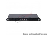 The image shows a black electronic device, which appears to be a power supply unit. It has a rectangular shape with a flat to...