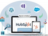 The image is an illustration that represents the process of migrating to HubSpot. It shows a laptop, a tablet, and a smartpho...