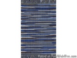 The image is a rectangular rug with a striped pattern. The stripes are evenly spaced and vary in width and thickness. The col...