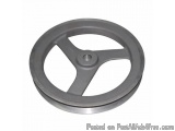 The image shows a gray-colored metal wheel with a circular center. The wheel appears to be made of metal and has a smooth, sh...