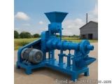 The image shows a blue-colored industrial machine, which appears to be a type of wood pellet making machine. It is mounted on...