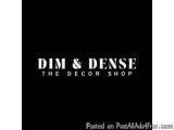 The image is a black square with white text in the center. The text reads "DIM & DENSE THE DECOR SHOP". The text is in all ca...