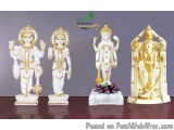 The image shows three Hindu deities, Lord Hanuman, Lakshmi, and Radha, standing side by side on a wooden surface. They are al...