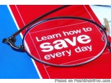 The image shows a pair of glasses resting on top of a red book with the words "Learn how to save every day" written in white...