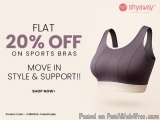The image is an advertisement for a sports bra from the brand Shyaway. The background is a light beige color and the text is...