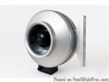 The image shows a round, silver-colored fan with a black base. The fan appears to be made of metal and has a cylindrical shap...
