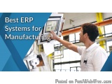 The image shows a man in a factory setting, operating an ERP system. He is wearing a white uniform and is standing in front o...