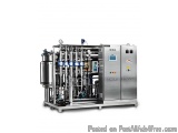 The image shows a large industrial machine, which appears to be a SWAL process. It is made of stainless steel and has a cylin...