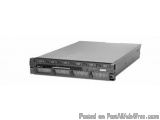 The image shows a black and white photograph of a server rack-mounted server. The server is rectangular in shape and has a fl...