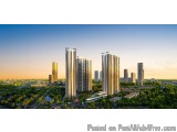 The image is an aerial view of a city with tall buildings and skyscrapers. The buildings are modern and have a unique archite...