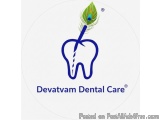 The image is a logo for Devatvam Dental Care. It is a circular logo with a white background. In the center of the logo, there...