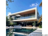 The image is of a modern, luxurious modern house with a large swimming pool in the backyard. The house is a two-story buildin...