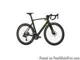 The image is of a green and black road bike. The bike has a sleek design with a black frame and handlebars. It has a black sa...