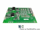 The image shows a green printed circuit board (PCB) with various electronic components attached to it. The board is rectangul...