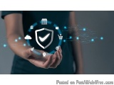 The image shows a person's hand holding a shield with a checkmark on it. The shield is surrounded by various icons representi...