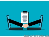 The image shows two laptops with a contract on the screen. The contract is written on a clipboard with the word "contract" wr...