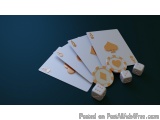 The image shows a group of playing cards and dice on a dark blue background. The cards are arranged in a scattered manner, wi...