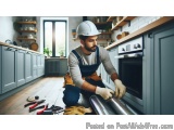 In this image, we can see a man wearing a white hard hat and overalls, kneeling on the floor in a kitchen. He is holding a ro...