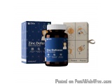 The image shows a bottle of Zinc Defense with L-Carnosine. The bottle is brown in color and has a white cap. It is placed nex...