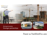 The image is an advertisement for PC Bodiwala & Associates, a construction company. The background of the image shows a const...