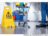 The image shows a person cleaning the floor with a mop. The person is wearing blue jeans and black shoes. On the left side of...