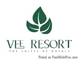 The image is a logo for VEE RESORT, a hotel and resort. The logo is a simple design with a white background and a green leaf-...