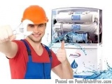 The image shows a young man wearing an orange hard hat and blue overalls, holding up a white foam roller and giving a thumbs...