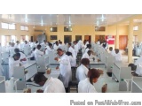 The image shows a large room with a high ceiling and large windows. The room appears to be a laboratory or a research facilit...