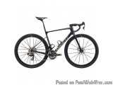The image is of a black and white road bike. The bike has a sleek design with a black frame and white accents. It has a black...