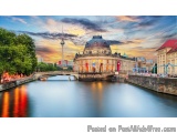 The image is a beautiful landscape photograph of the Berliner Dom, a famous landmark in Berlin, Germany. The photograph is ta...