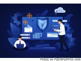 The image shows two men in front of a large computer monitor with a blue background. On the monitor, there is a shield with a...