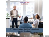 The image shows a man standing in an office, holding a tablet and explaining something to a group of people sitting around a...