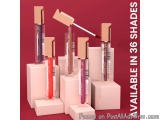 The image shows a group of six lip glosses arranged in a row on a white pedestal. The lipsticks are of different shades and s...
