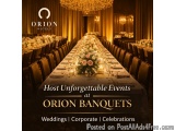 The image shows a long, elegant banquet hall with a long table set up for a formal event. The table is covered with a white t...