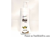The image is of a white plastic bottle with a pump dispenser. The bottle is cylindrical in shape and has a label on the front...