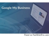 The image shows a laptop on a desk with a blue background. The laptop screen displays a webpage with the title "Google My Bus...