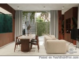 The image shows a modern and luxurious living room with a large window that offers a view of the garden outside. The room has...
